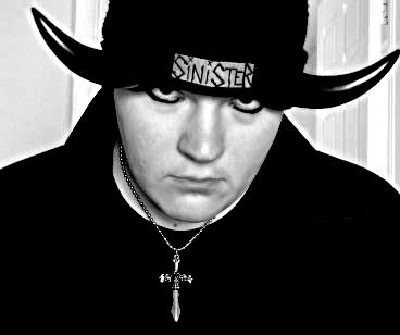 Sinister Minister
Greetings to all dark creatures. 
I am a member of the OCS Forum, and I've wanted to send my photo here... I hope you all like it...

Keywords: devil, sinister, minister, horns, eyeliner