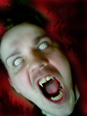 Crimson Rage
My Photoshop modification of myself. What can I say? Vampires DO exist!!
Keywords: Vampire Fangs Scream Crimson Rage
